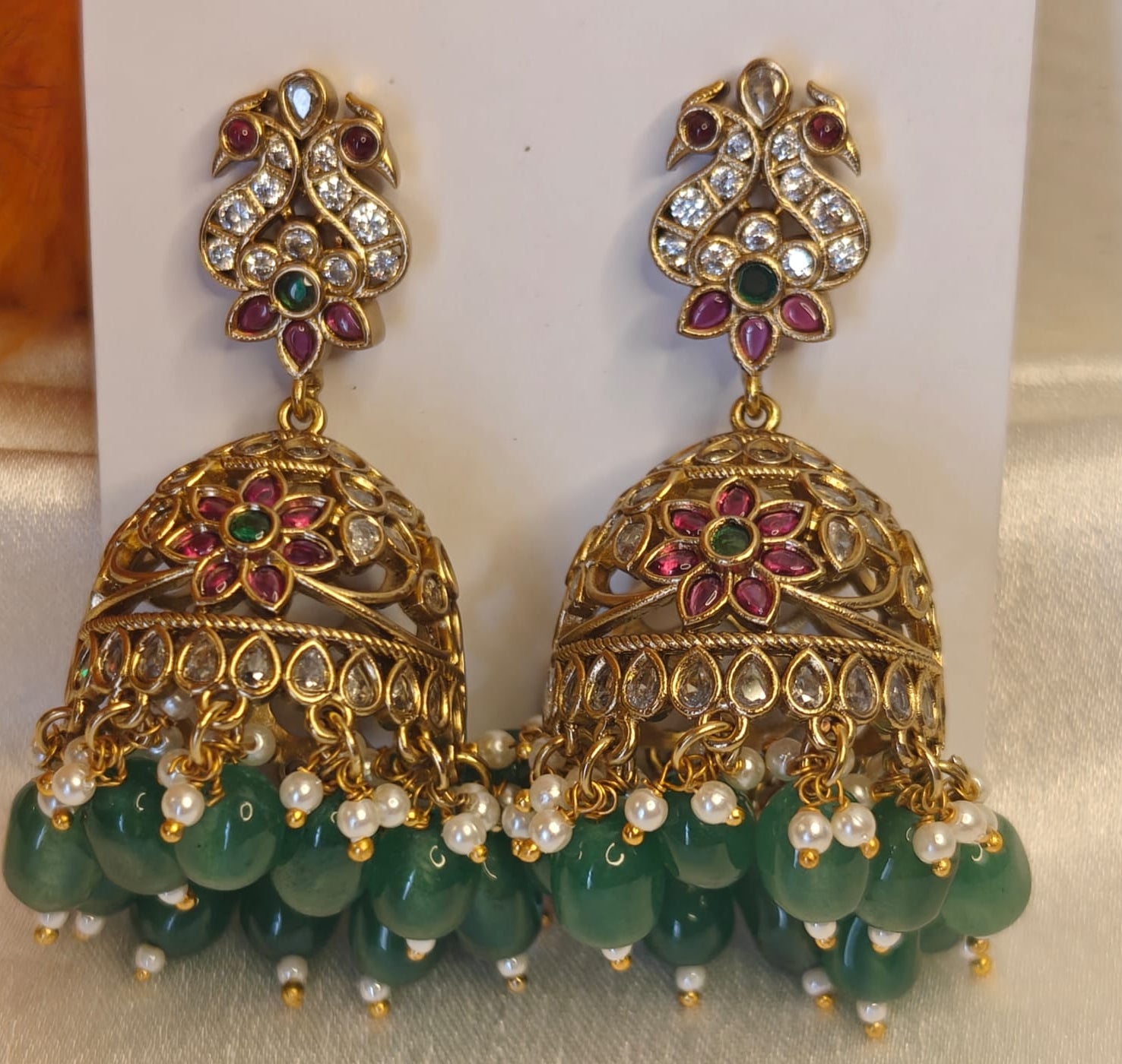 Ornate Gold and Emerald Green Drop Earrings for Festive Wear